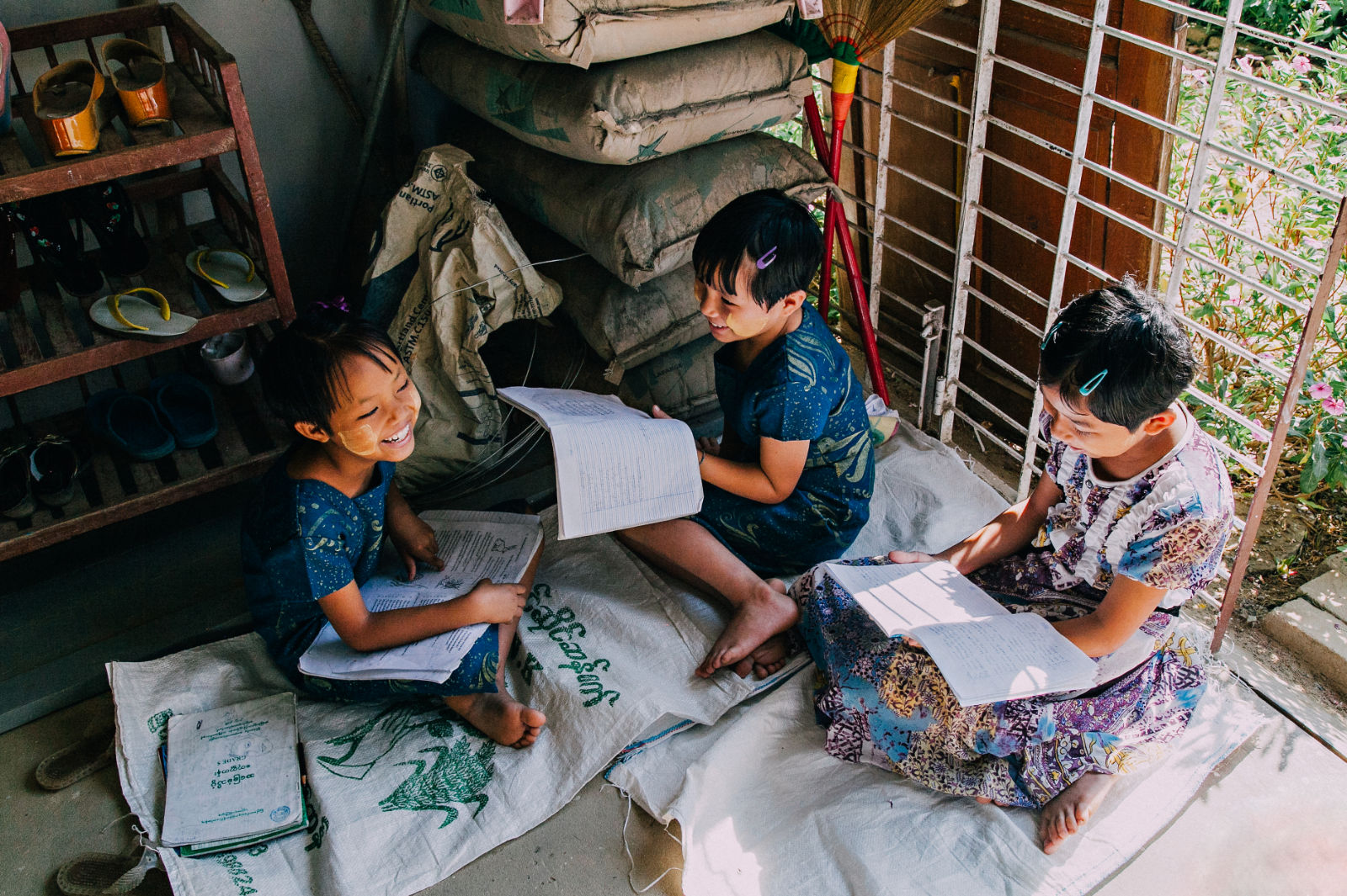 Three Girls studying together, this is why we work at Ending Child Sex Slavery through prevention