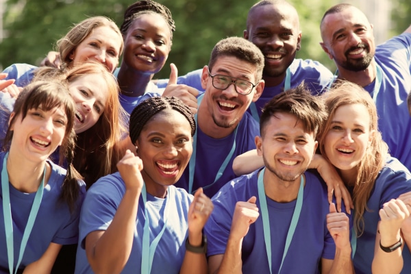 A group of people standing in front of a home